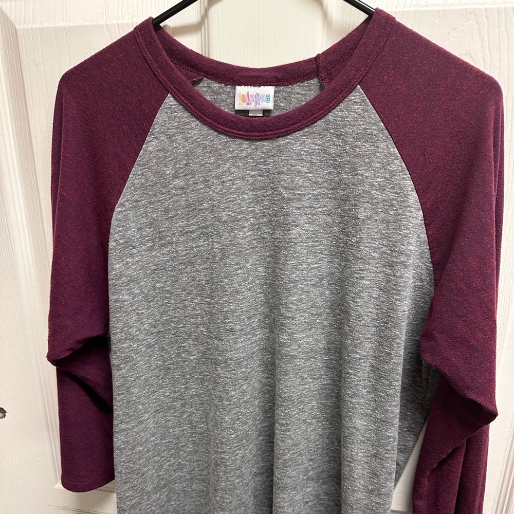 3/4 length grey and maroon shirt